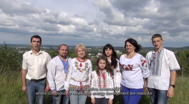 7 community members standing as a group in front of Boryslav city